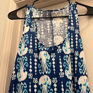 Dress with scalloped bottom.